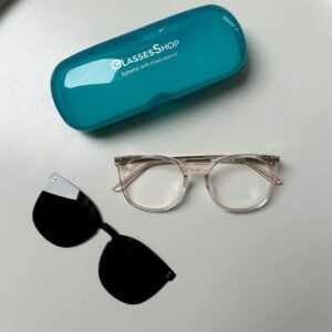 Elegant eyeglass frames and clip-on sunglasses on a white background.