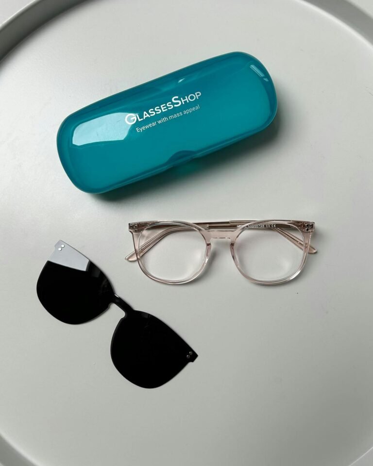 Elegant eyeglass frames and clip-on sunglasses on a white background.